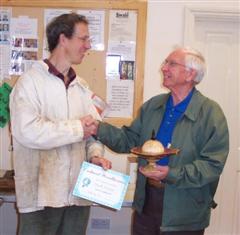 The monthly Highly commended Smith Adams received his certificate from Tobias Kaye